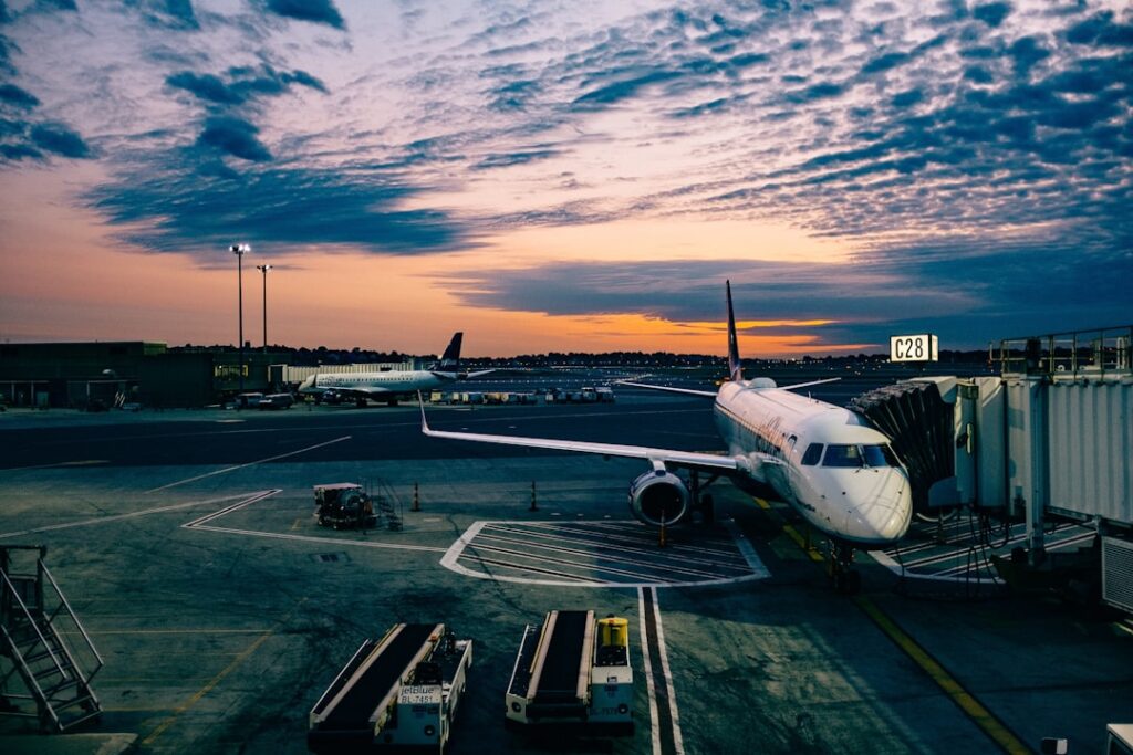 A lawyer reviewing aviation documents with an airplane in the background